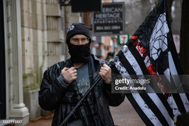 Demonstrators from several gun rights groups come together for a rally and food drive outside of the Virginia State Capitol in Richmond, Virginia on...