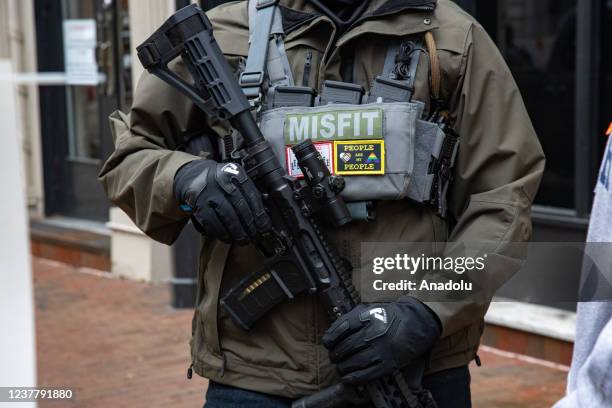 Demonstrators from several gun rights groups come together for a rally and food drive outside of the Virginia State Capitol in Richmond, Virginia on...