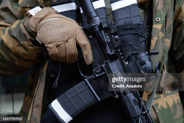 Demonstrators from several gun rights groups come together for a rally and food drive outside of the Virginia State Capitol in Richmond, Virginia on...