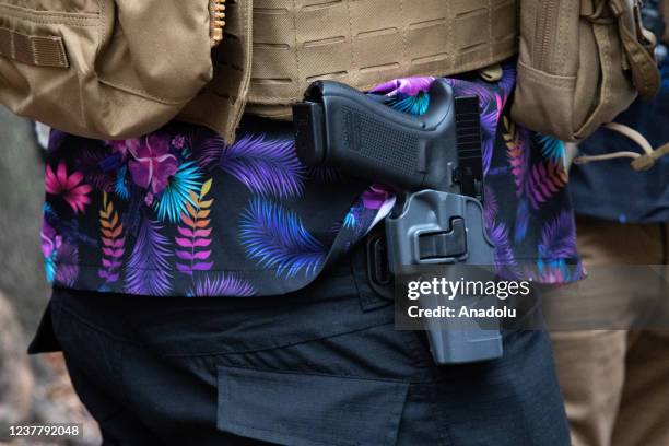 Weapon on a demonstrator is seen during a gun rights rally outside of the Virginia State Capitol in Richmond, Virginia on January 17, 2022