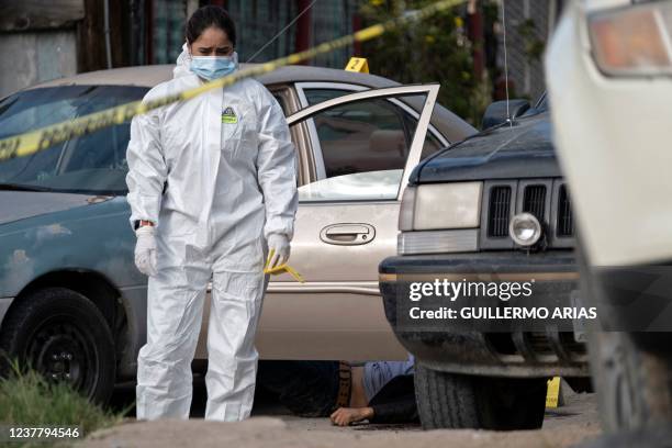 The body of Mexican photojournalist Margarito Martinez lies on the ground after he was shot dead near his house in Tijuana, Baja California State,...