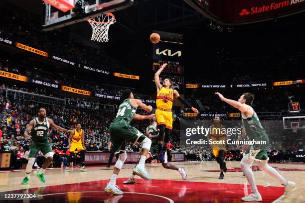 Trae Young of the Atlanta Hawks shoots the ball during the game against the Milwaukee Bucks on January 17, 2022 at State Farm Arena in Atlanta,...