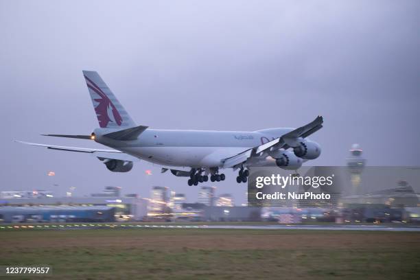 Qatar Airways Cargo Boeing 747-8F freight variant aircraft as seen landing at Amsterdam Schiphol Airport AMS EHAM in the evening. The quad jet Boeing...