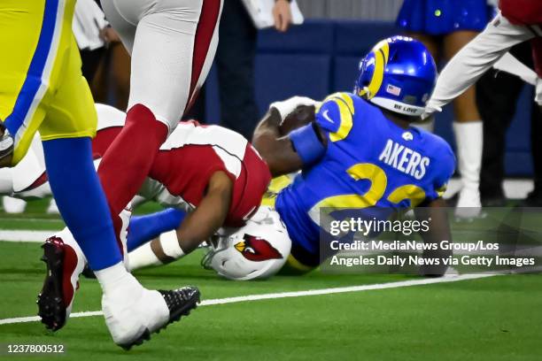 Los Angeles, CA Cardinals Budda Baker, #3, suffered an injury as his head was tucked under Rams Cam Akers, #23, during fourth quarter action in the...