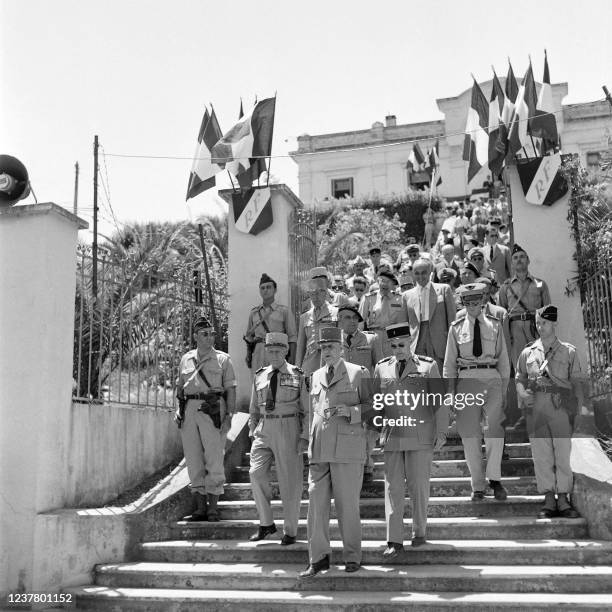 French President of Council General Charles de Gaulle , accompanied by General Raoul Salan , visits troops on July 2, 1958 at Fort National in...
