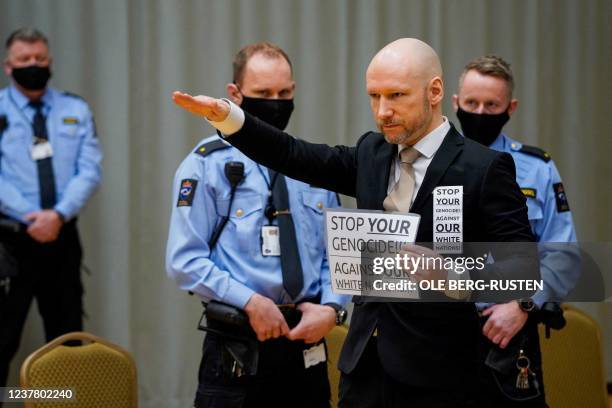 Anders Behring Breivik raises his arm to make a Nazi salute as he arrives on the first day of the trial where he is requesting release on parole, on...