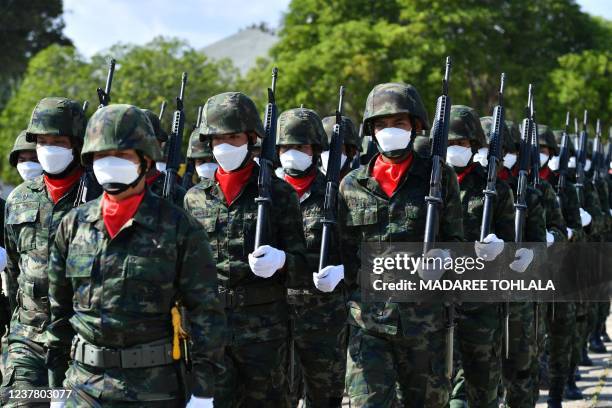 Thai soldiers march during celebrations to mark Royal Thai Armed Forces Day at Chulabhorn Camp in the southern Thailand province of Narathiwat on...