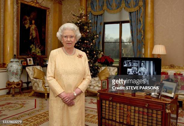 Britain's Queen Elizabeth II poses during the taping of her Christmas Day message to Britain and the Commonwealth in the 1844 Room at Buckingham...