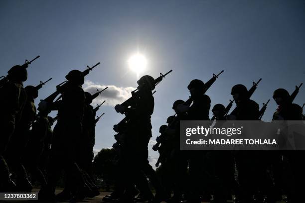 Thai soldiers march during celebrations to mark Royal Thai Armed Forces Day at Chulabhorn Camp in the southern Thailand province of Narathiwat on...