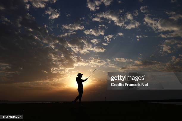 Jazz Janewattananond of Thailand hits an approach shot during a practice round prior to the Abu Dhabi HSBC Championship at Yas Links Golf Course on...