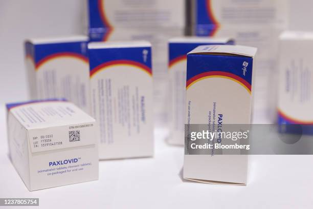 Boxes of Pfizer Inc.s Paxlovid antiviral medication arranged in a warehouse in Shoham, Israel, on Jan. 18, 2022. A fourth dose of the Pfizer-BioNTech...