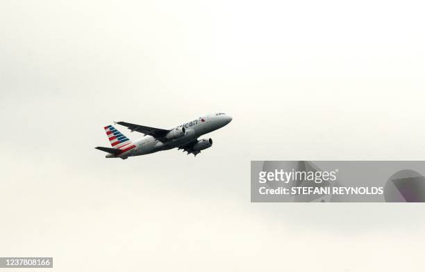 An American Airlines plane takes off from Ronald Reagan National Airport in Arlington, Virginia, on January 18 as seen from Washington, DC. - The...