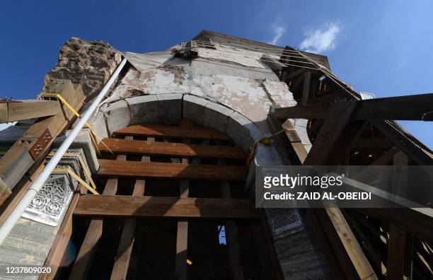 This picture taken on January 18, 2022 shows renovations at the al-Nuri mosque in the old town of Iraq's northern city Mosul, at the site heavily...