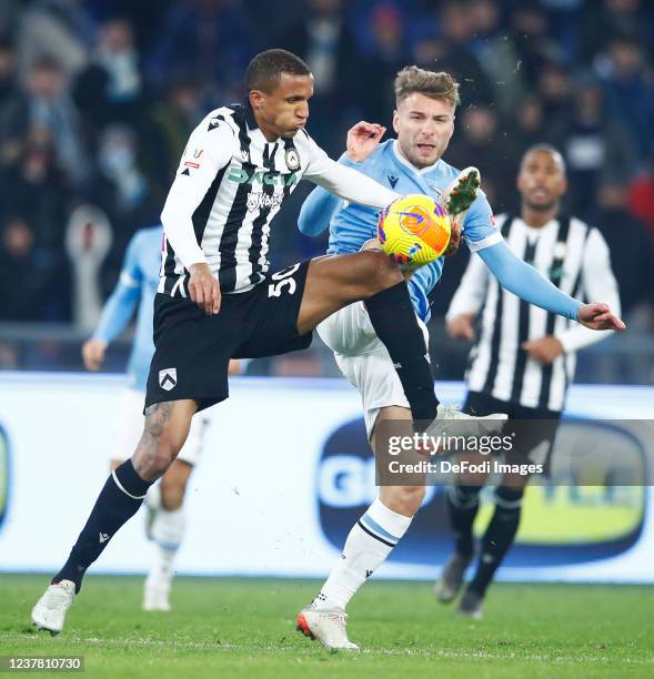 Rodrigo Becao of Udinese Calcio and Ciro Immobile of SS Lazio battle for the ball during the Coppa Italia match between Juventus and UC Sampdoria at...