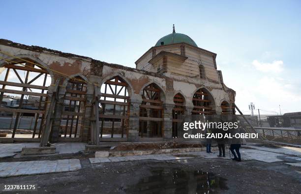 This picture taken on January 18, 2022 shows renovations at the al-Nuri mosque in the old town of Iraq's northern city Mosul, at the site heavily...