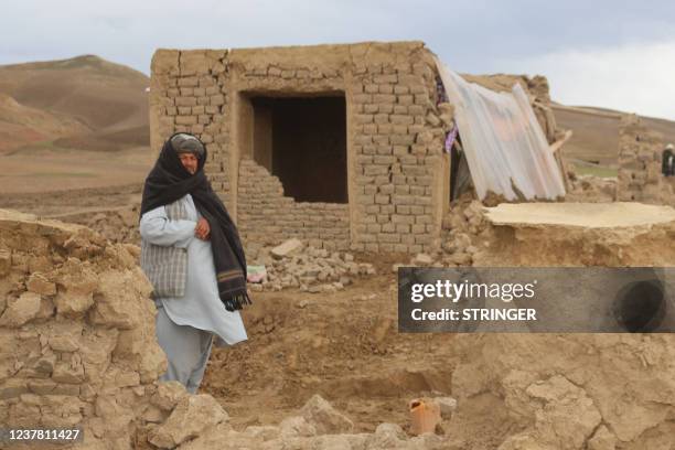 Local resident stands near a damaged house at Qadis district in Afghanistan's western Badghis Province, on January 18 after an earthquake hit the...