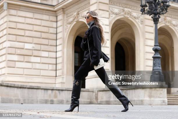 Influencer Saraja Roberta Elez wearing a grey cashmere turtleneck pullover by Bazilika, a black blazer by Bazilika, black shorts by Prada, black...