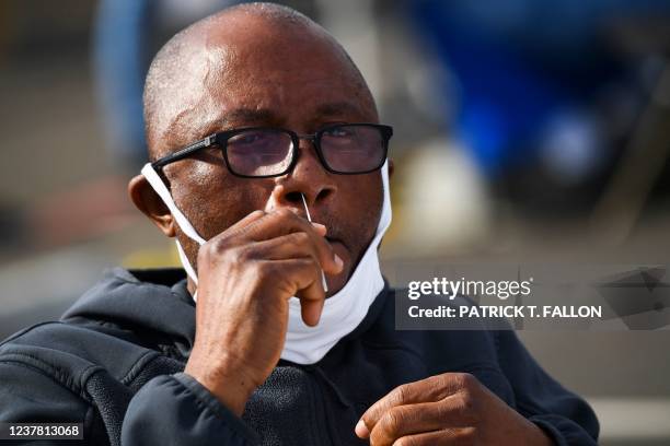 Person swabs their nose as they receive testing for both rapid antigen and PCR Covid-19 tests at a Reliant Health Services testing site in Hawthorne,...