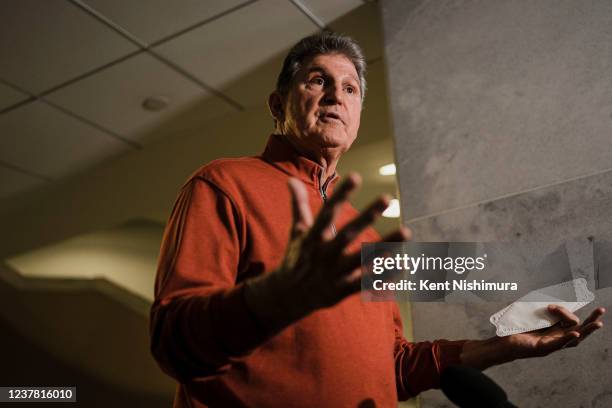 Sen. Joe Manchin speaks during a press availability ahead of a Senate democratic caucus meeting on voting rights and the filibuster on Capitol Hill...