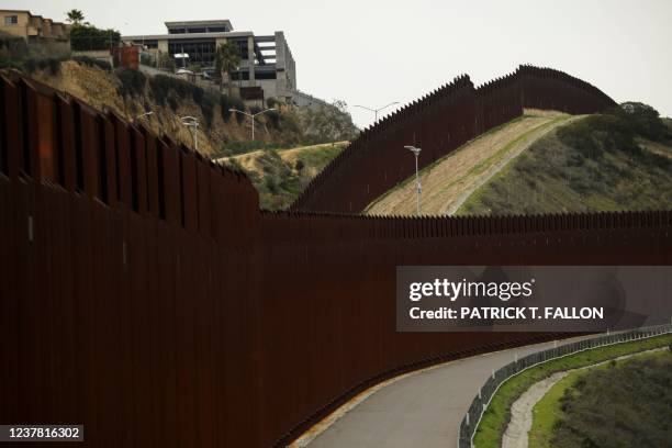 Section of the US-Mexico border wall between San Diego and Tijuana on January 12, 2022 in San Diego County, California. - When Joe Biden became...