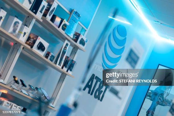 The AT&T logo is displayed at a store in Washington, DC, on January 18, 2022. - AT&T and Verizon agreed Tuesday to a partial delay in activating...