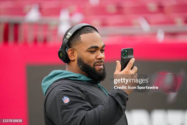 Philadelphia Eagles defensive end Brandon Graham talks on his phone during the game between the Philadelphia Eagles and the Tampa Bay Buccaneers on...