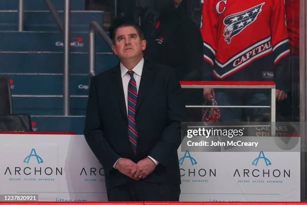 Washington Capitals head coach Peter Laviolette watches the Willie ORee tribute on the scoreboard just before a game against the Winnipeg Jets at...