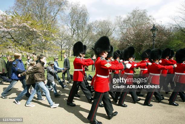 School children from Hannover in Germany, march behind a company of British Guardsmen through St James' Park in London, on March 30 following a...