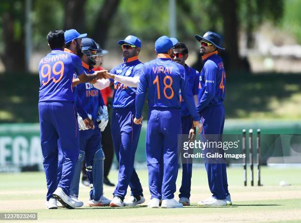 Ravichandran Ashwin team mates of India celebrate the wicket of Quinton de Kock of South Africa during the 1st Betway One Day International match...