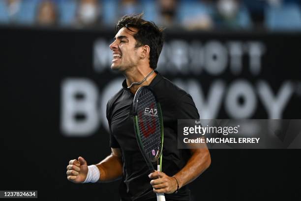 Chile's Christian Garin celebrates after beating Spain's Pedro Martinez in their men's singles match on day three of the Australian Open tennis...