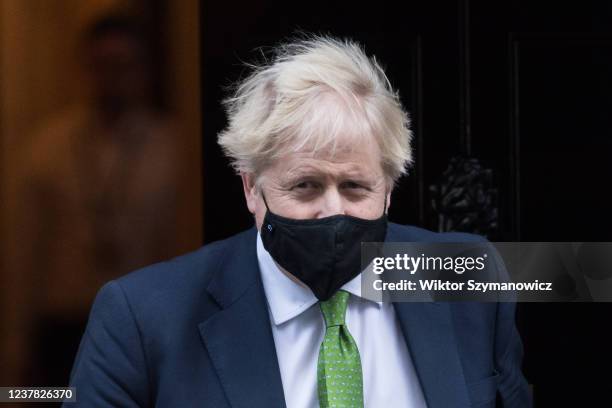 British Prime Minister Boris Johnson leaves 10 Downing Street for PMQs at the House of Commons on January 19, 2022 in London, England. Folowing the...