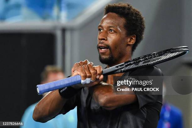 France's Gael Monfils celebrates after beating Kazakhstan's Alexander Bublik in their men's singles match on day three of the Australian Open tennis...