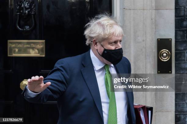 British Prime Minister Boris Johnson leaves 10 Downing Street for PMQs at the House of Commons on January 19, 2022 in London, England. Folowing the...