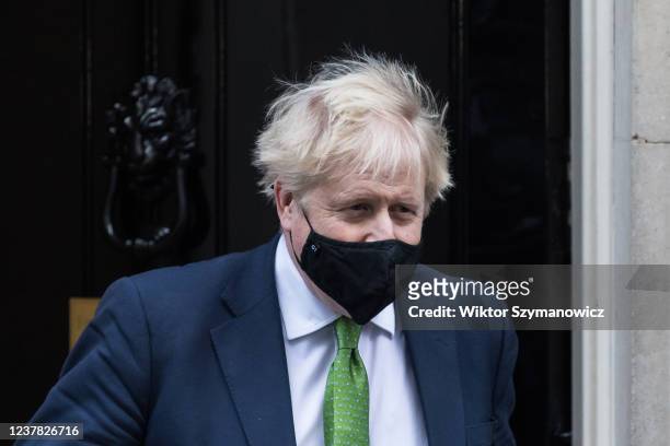 British Prime Minister Boris Johnson leaves 10 Downing Street for PMQs at the House of Commons on January 19, 2022 in London, England. Folowing the...