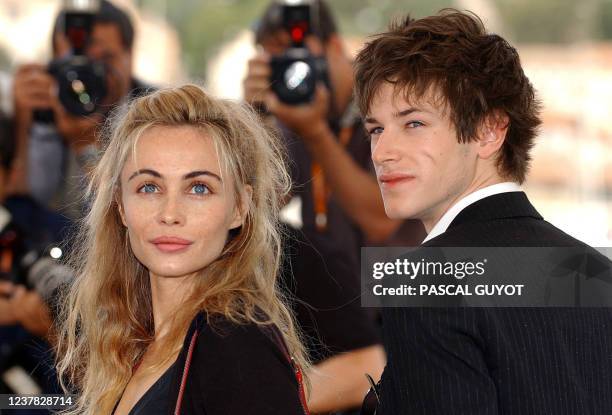 French actress Emmanuelle Beart and actor Gaspard Ulliel pose for photographers on a terrace of the Palais des festivals during the photocall for...