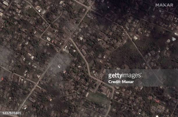 Maxar closeup satellite imagery shows the ash covered homes and buildings on January 18 after the Hunga Tonga-Hunga Ha'apai volcano eruption on...