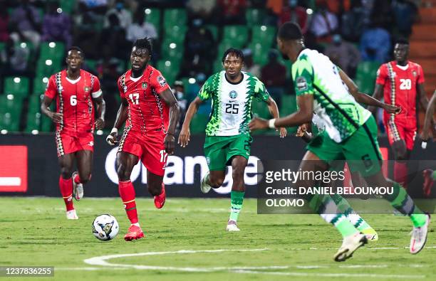 Guinea-Bissau's midfielder Mama Balde fights for the ball with Nigeria's midfielder Kelechi Nwakali during the Group D Africa Cup of Nations 2021...