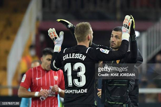 Valencia's Dutch goalkeeper Jasper Cillessen is substitued onto the pitch for Valencia's Spanish goalkeeper Jaume Domenech during the Spanish league...