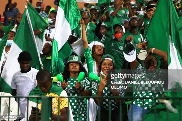 Nigeria supporters cheer after their team won the Group D Africa Cup of Nations 2021 football match between Guinea-Bissau and Nigeria at Stade Roumde...