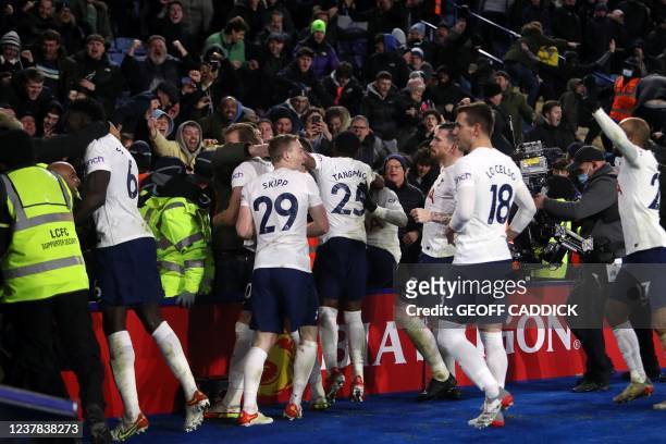 Tottenham Hotspur's Dutch midfielder Steven Bergwijn celebrates scoring his team's third goal past Leicester City's Danish goalkeeper Kasper...