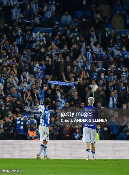 Real Sociedad's Spanish forward Mikel Oyarzabal celebrates with supporters at the end of the Copa del Rey round of 16 first leg football match...