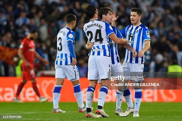 Real Sociedad's players celebrate at the end of the Copa del Rey round of 16 first leg football match between Real Sociedad and Club Atletico de...