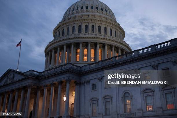 Shows US President Joe Biden during a press conference as the Senate is expected to consider the legislation tonight on Capitol Hill January 19 in...