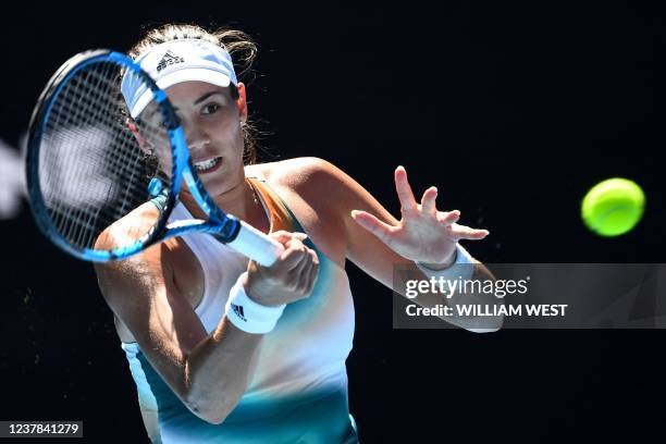 Spain's Garbine Muguruza hits a return against France's Alize Cornet during their women's singles match on day four of the Australian Open tennis...