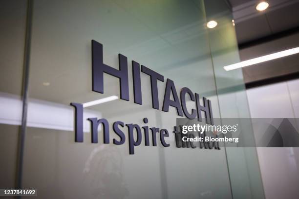 The logo of Hitachi Ltd. Displayed at the company's headquarters in Tokyo, Japan, on Jan. 18, 2022. Hitachi is ready to sell its 40% stake in Hitachi...