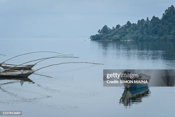 Passenger boat is seen on Lake Kivu in Kibuye, Karongi District, in the Western Province of Rwanda, on November 1, 2021. - Thousands of years of...