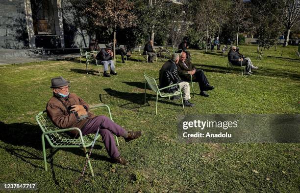 Elders spend time in a park in Tirana, Albania on January 17, 2022.