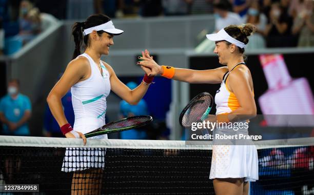 Emma Raducanu of Great Britain and Danka Kovinic of Montenegro shake hands at the net after their second round singles match at the 2022 Australian...