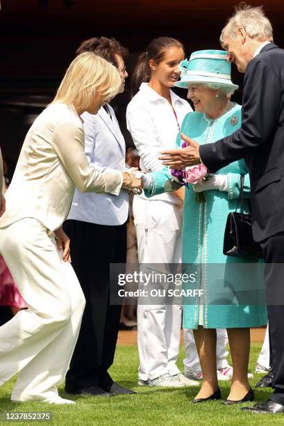 Former US tennis player Martina Navratilova meets Britain's Queen Elizabeth II during a visit to the 2010 Wimbledon Lawn Tennis Championships in...