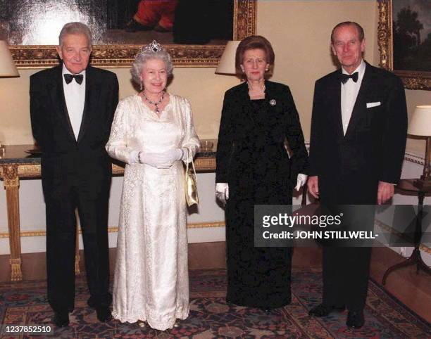 Israeli President Mr Ezer Weizman and his wife Reuma pose with Queen Elizabeth II and Duke of Edinburgh after hosting a return banquet on the final...